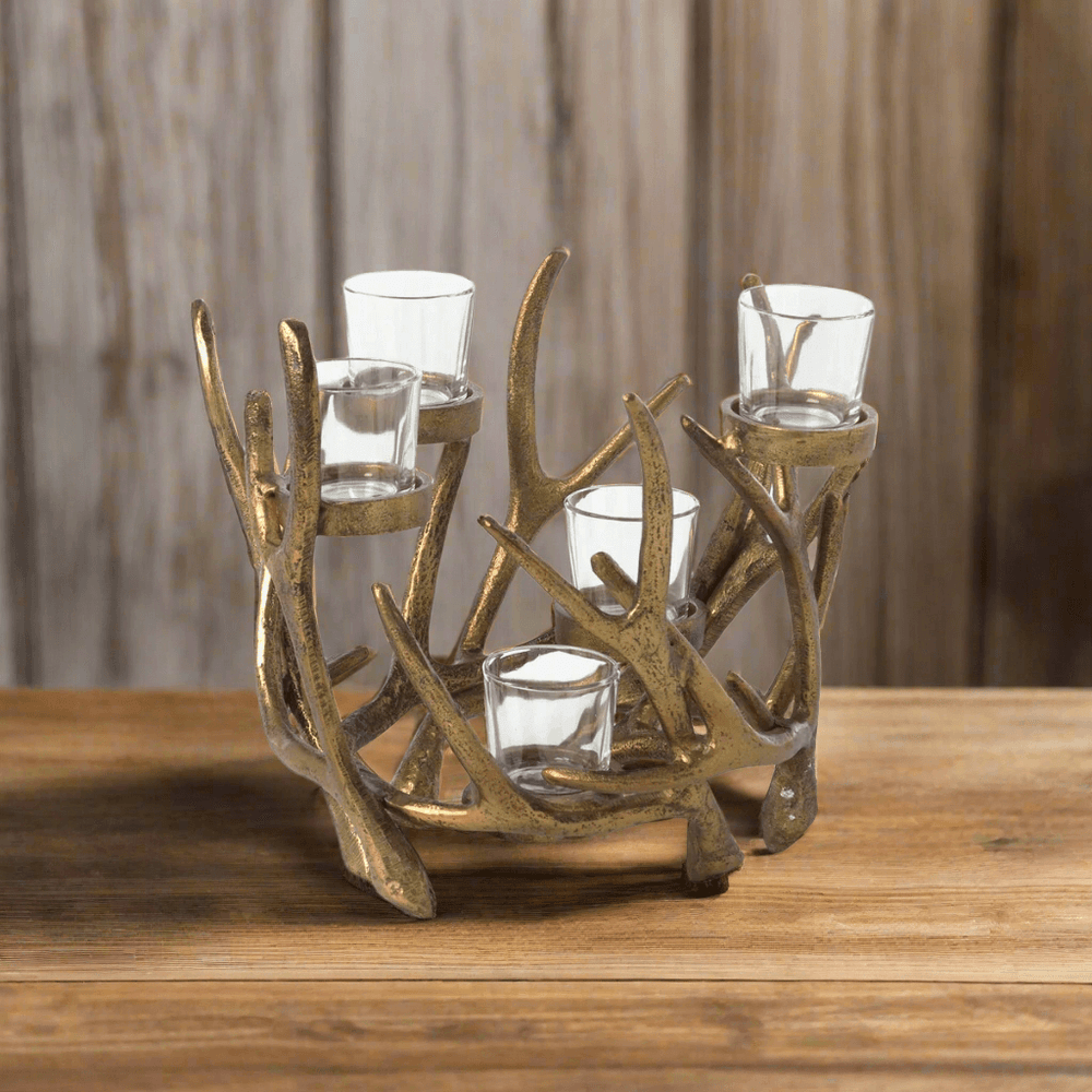 Vintage Gold Antler Candle Holder Centerpiece with glass votive cups on wooden table, showcasing rustic and vintage design elements.
