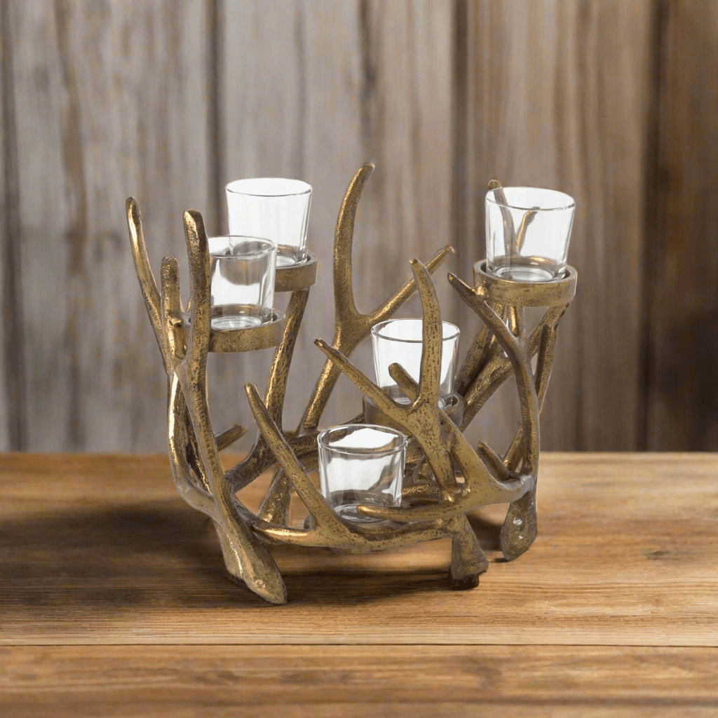 Vintage Gold Antler Candle Holder Centerpiece with glass votive cups on wooden table, showcasing rustic and vintage design elements.