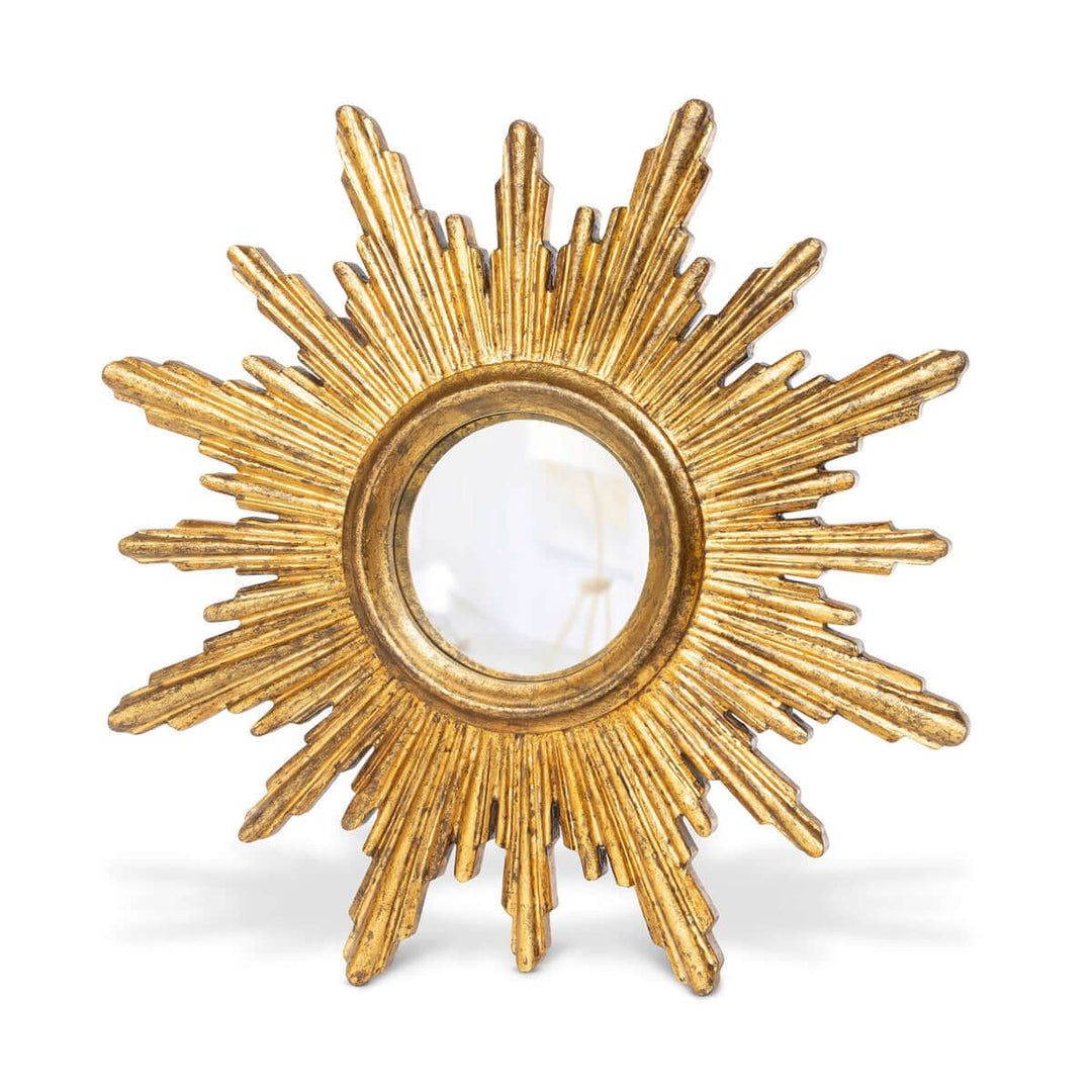 Vintage gold sunburst wall mirror with mid-century design and antiqued finish, featuring striking sculpted rays encircling a round center.