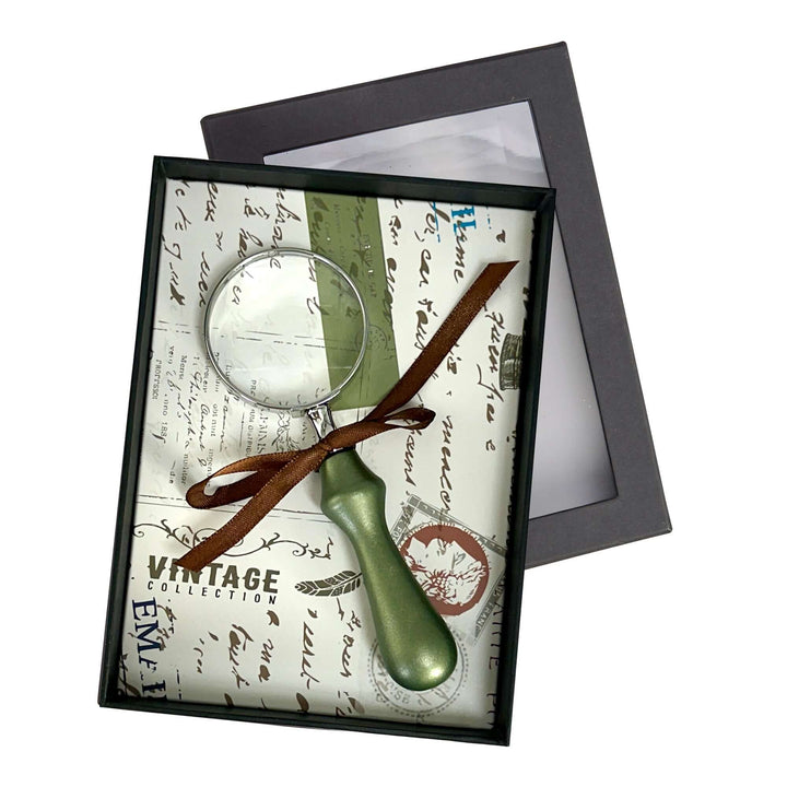 Vintage Handheld Magnifier with Wood Handle in decorative packaging.