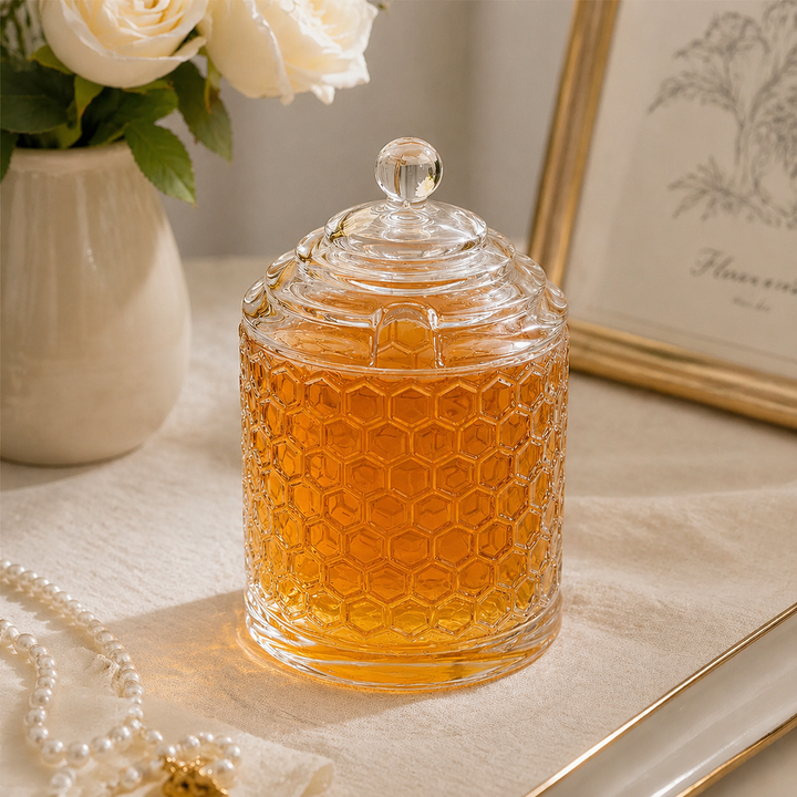 Honeycomb embossed glass storage jar displayed in a softly lit interior