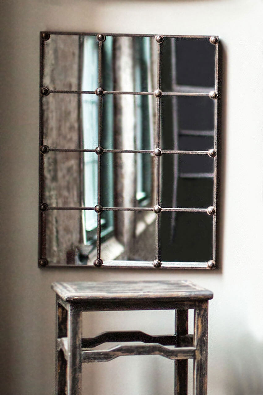 Vintage Industrial Grid Wall Mirror with rustic metal frame and windowpane design enhancing space with character and depth.
