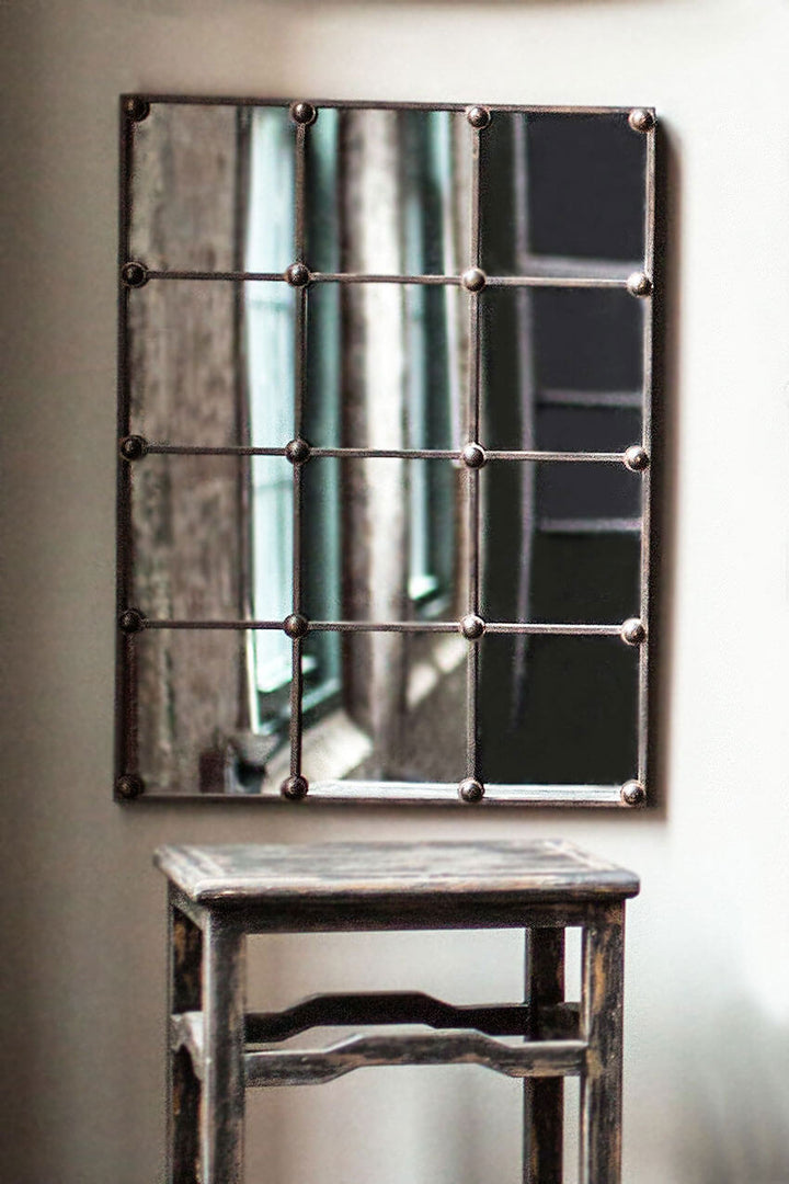 Vintage Industrial Grid Wall Mirror with rustic metal frame and windowpane design enhancing space with character and depth.