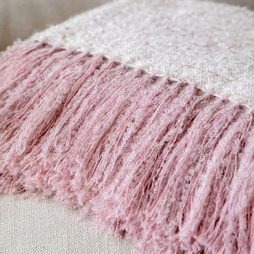 Vintage Light Blush Boucle Alpaca Wool Throw Blanket with fringe detail, showcasing soft texture and elegant design, handwoven by artisans.
