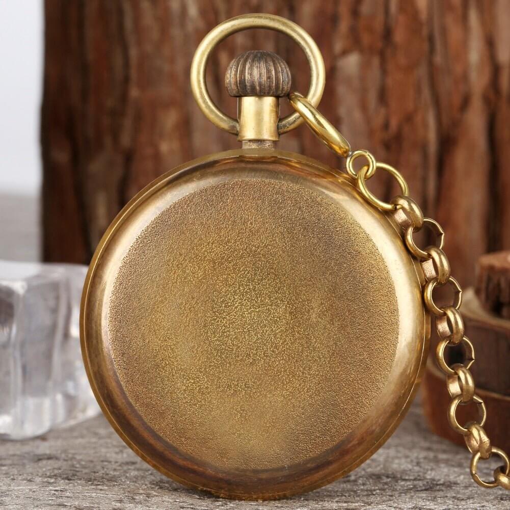 Vintage London Mechanical Pocket Watch with brass finish and chain, showcasing antique charm and elegance.