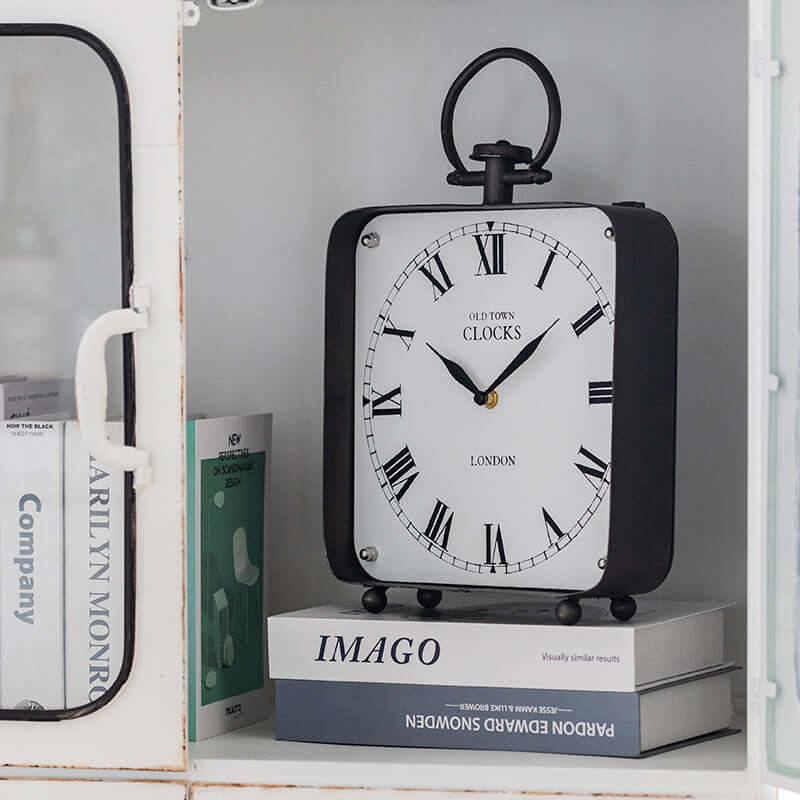 Vintage Old Town London Desk Clock displayed on stacked books, showcasing classic British design and elegance.