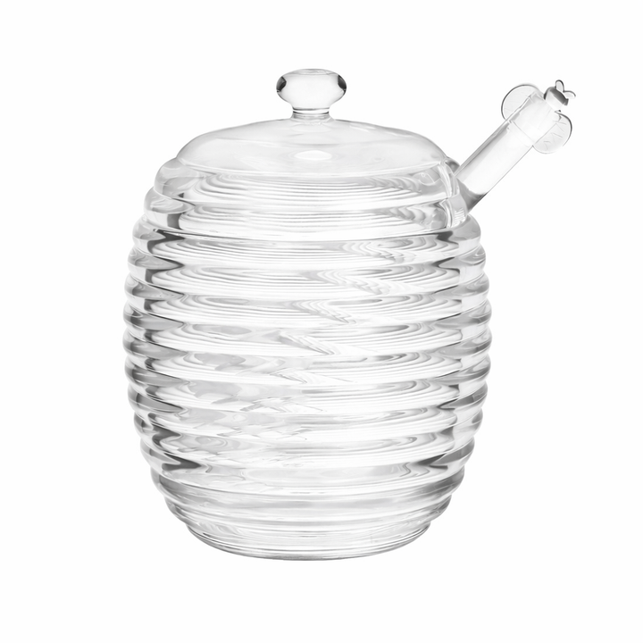 Vintage-inspired glass honey jar photographed against a clean white background