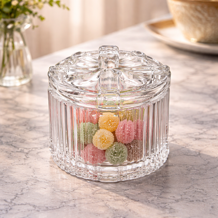 Close view of the ribbed glass bowl and dimensional bow-shaped lid