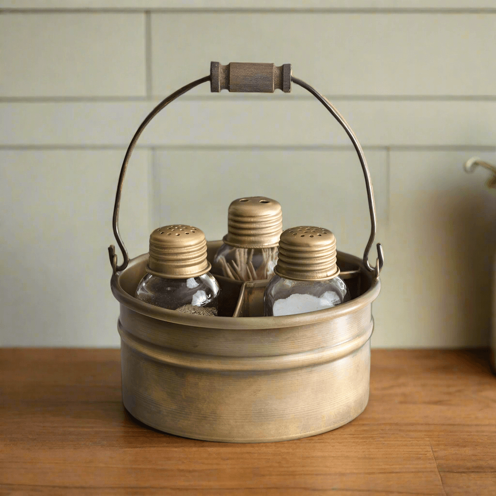 Vintage antique brass salt, pepper, and toothpick caddy with wooden handle for farmhouse kitchen decor.