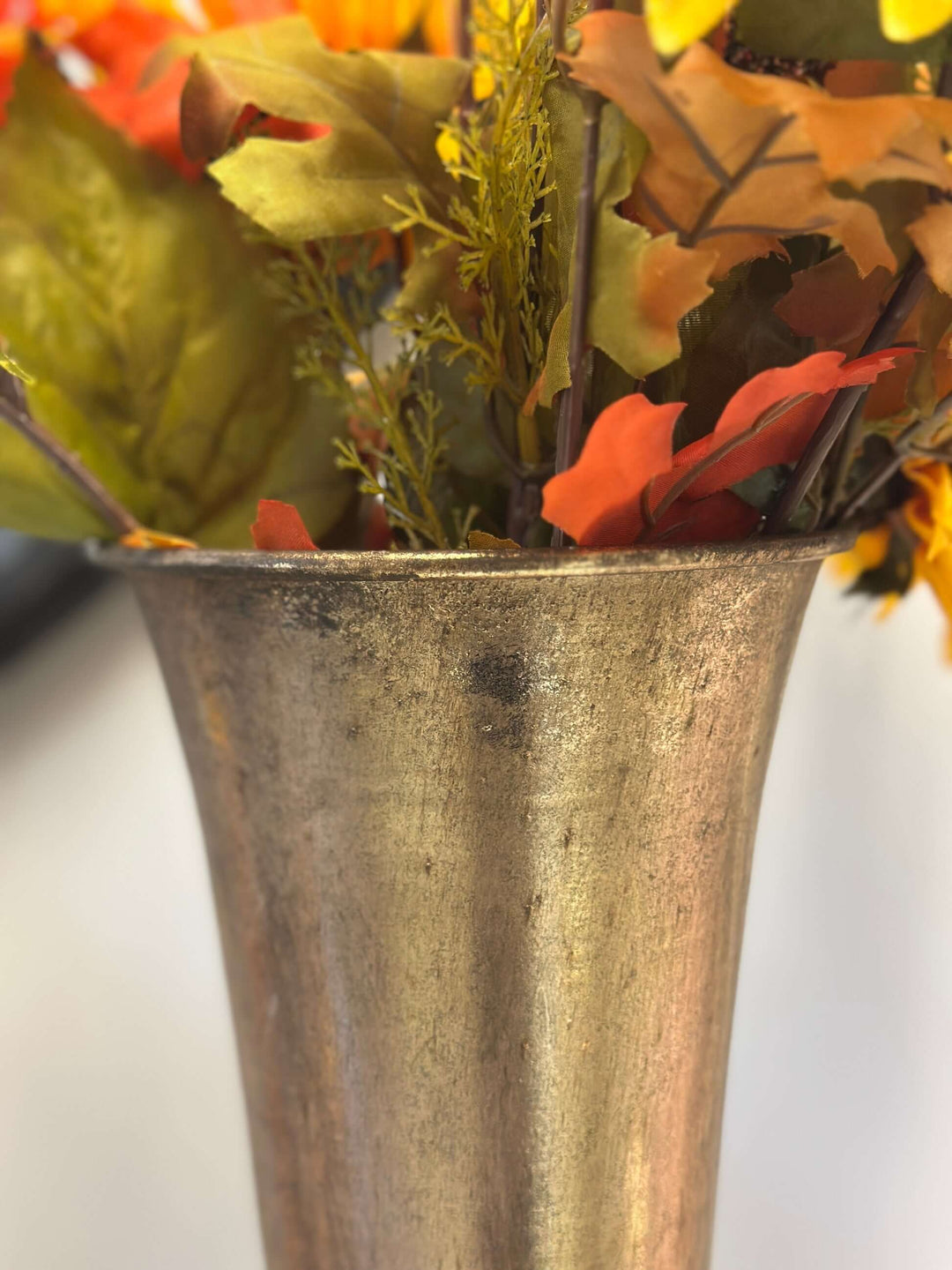 Vintage tall gold trumpet vase with fall floral arrangement, showcasing elegant antique finish and timeless design.