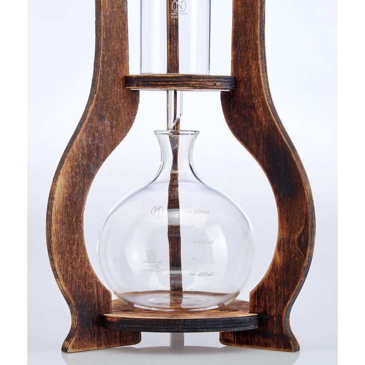 Close-up of Vintage Wooden Cold Brew Coffee Maker Tower with hand-blown glass vessel.