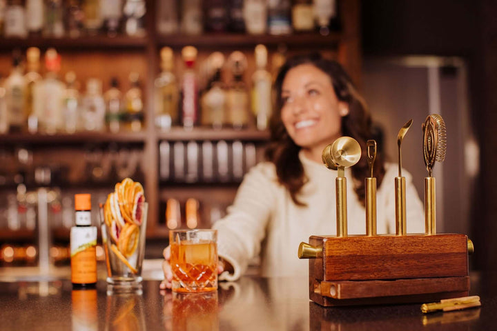 Vintage-Inspired Bar Tool Set with Brass Finish displayed on a bar counter