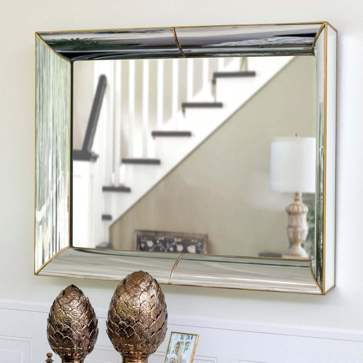 Vintage Beveled Wall Mirror with Gold Trim hanging in hallway, reflecting staircase and lamp.