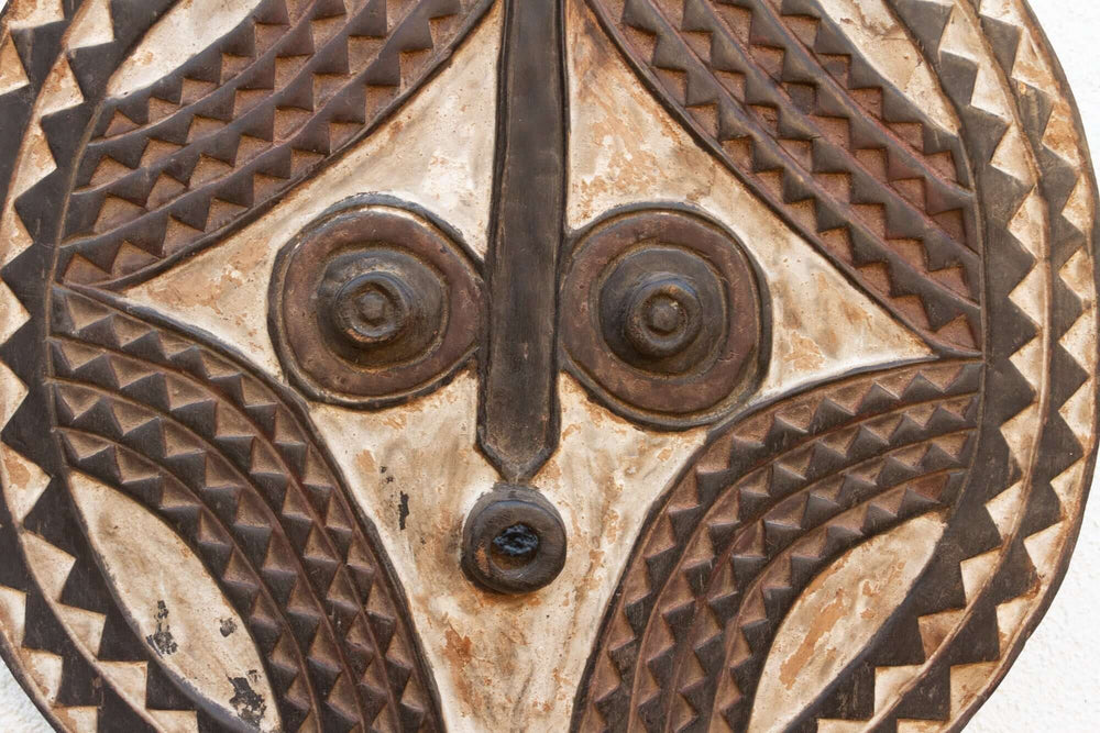 Vintage Bobo African Sun Mask from Burkina Faso, hand-carved wooden mask with intricate patterns and aged patina reflecting Bobo art symbolism.