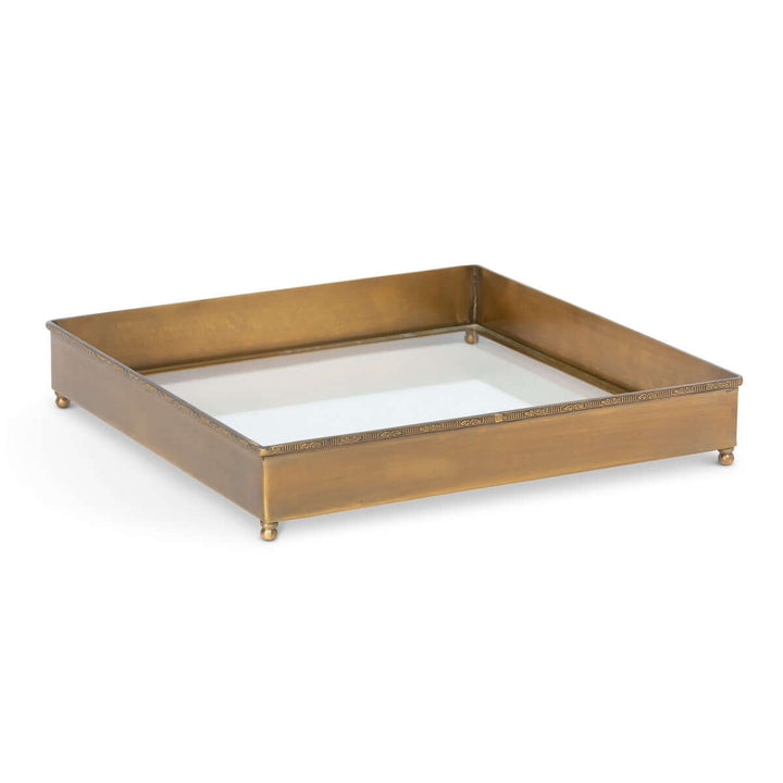 Vintage Brass and Glass Desk Tray with a golden brass frame and clear glass base on polished ball feet.