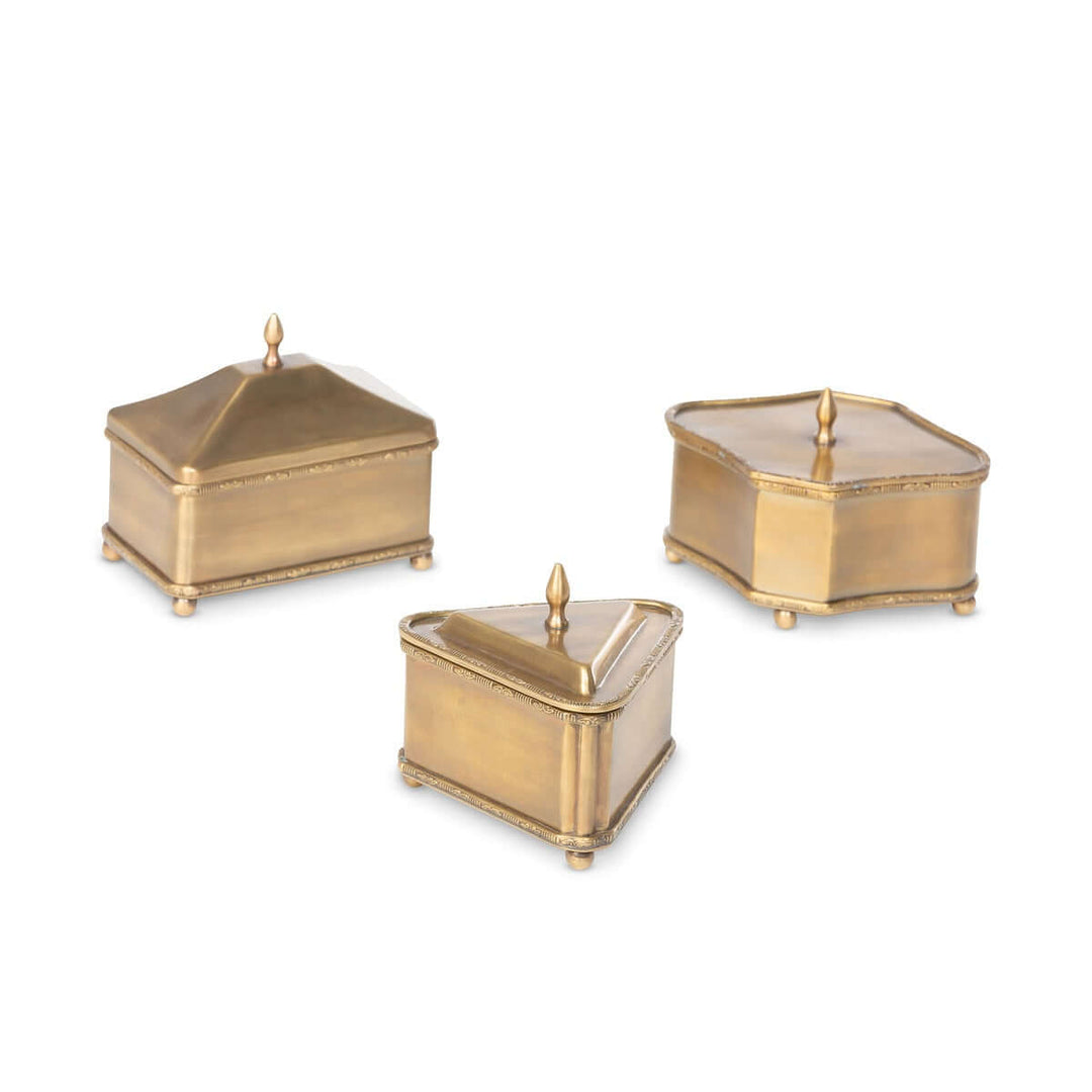 Vintage brass trinket boxes set of three with triangle, rectangle, and diamond shapes, featuring lids and decorative ball feet.