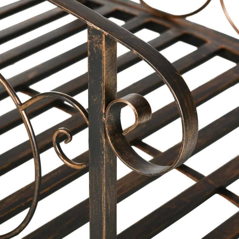 Close-up of ornate scrollwork on the Vintage Bronze Arch Garden Bridge with Scrollwork highlighting its antique finish.