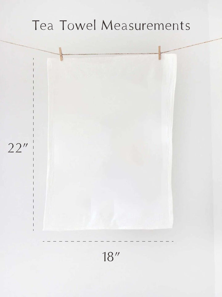 Tea towel displaying dimensions of 22 inches by 18 inches, ideal for coastal kitchen decor.