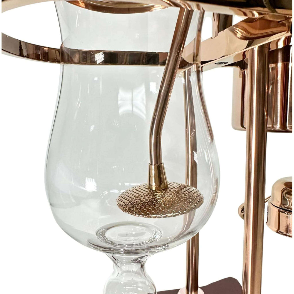 Close-up of Vintage Copper Belgian Balance Siphon Coffee Maker with glass chamber and copper details.