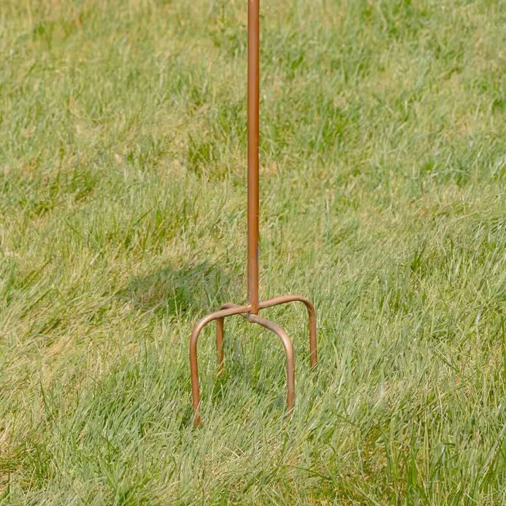Vintage Copper Finish Garden Birdhouse with Stake on grassy lawn