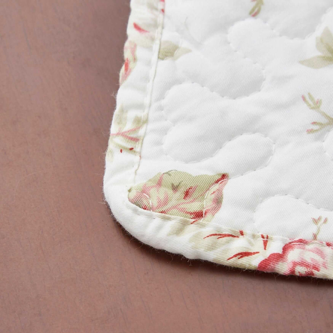 Close-up of Vintage Cottage Rose Quilted Placemat showing floral pattern and stitching, part of a set of 4 for farmhouse elegance.