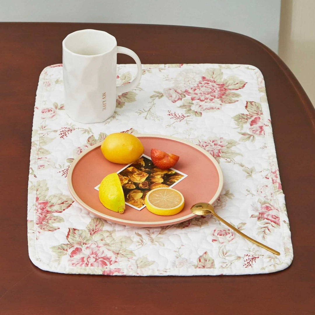 Vintage Cottage Rose Quilted Placemats (Set of 4) on table with fruit and mug
