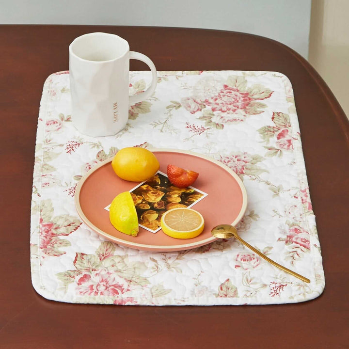 Vintage Cottage Rose Quilted Placemats (Set of 4) on table with fruit and mug