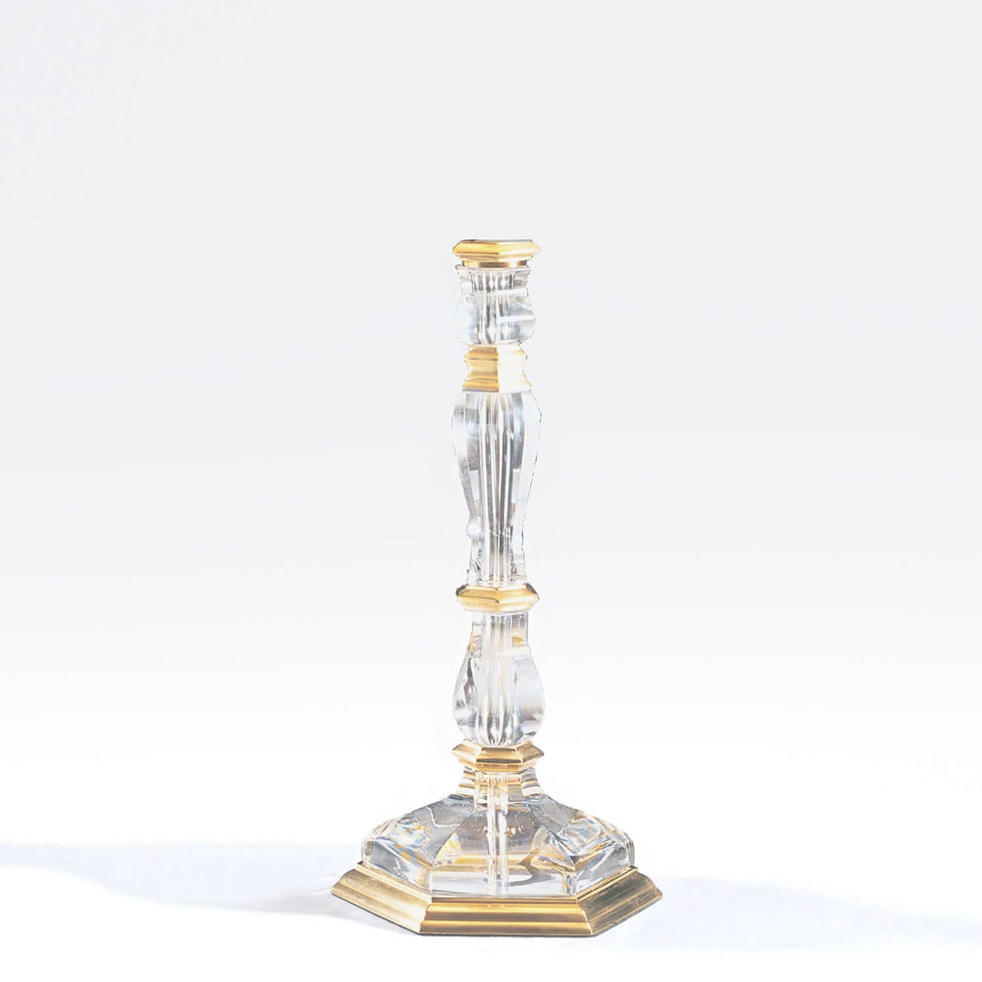 Decorative candlestick with gold accents on a white background