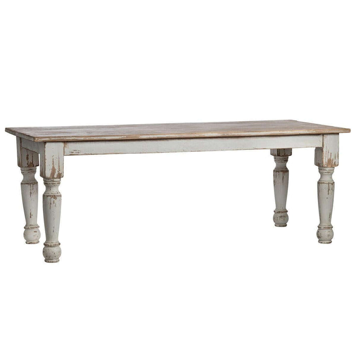 Vintage Farmhouse Harvest Dining Table in Antique White with distressed finish and hand-turned legs, evoking rustic country charm.