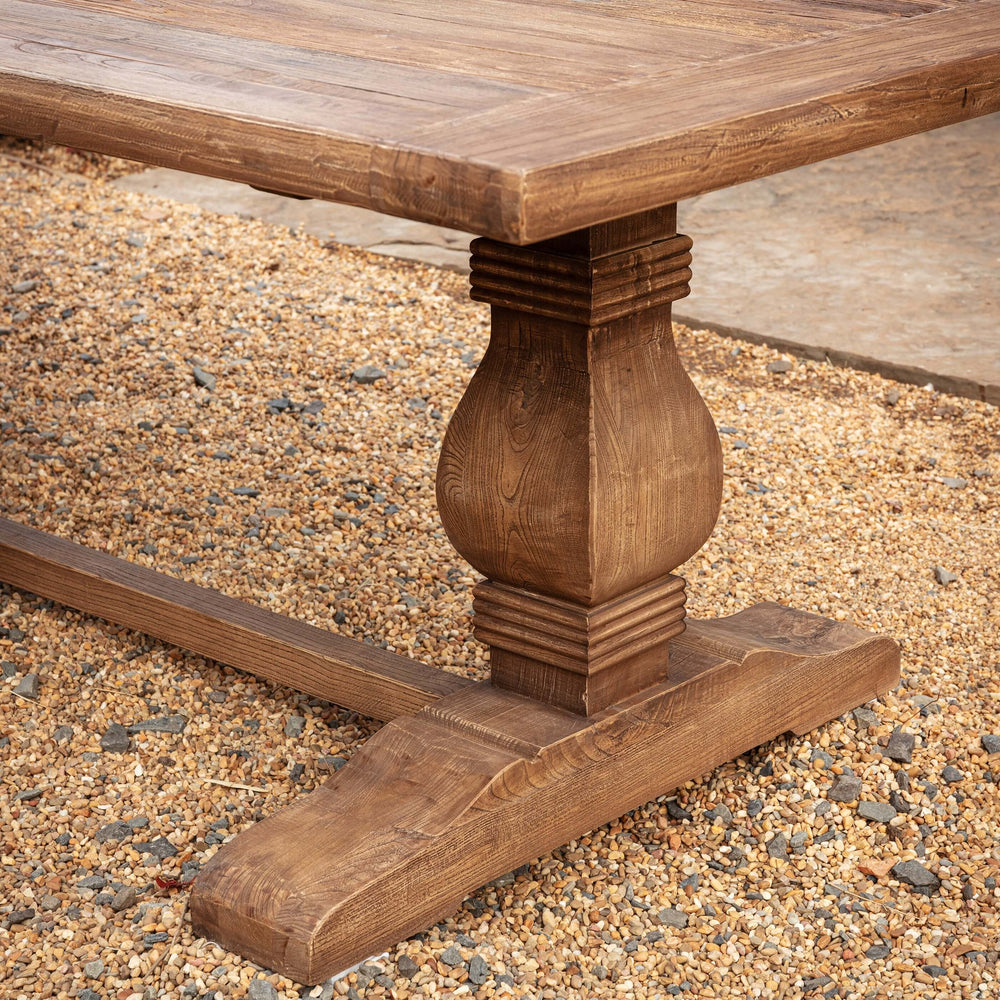 Close-up of Vintage Farmhouse Harvest Dining Table showing its rustic wooden craftsmanship and natural finish.