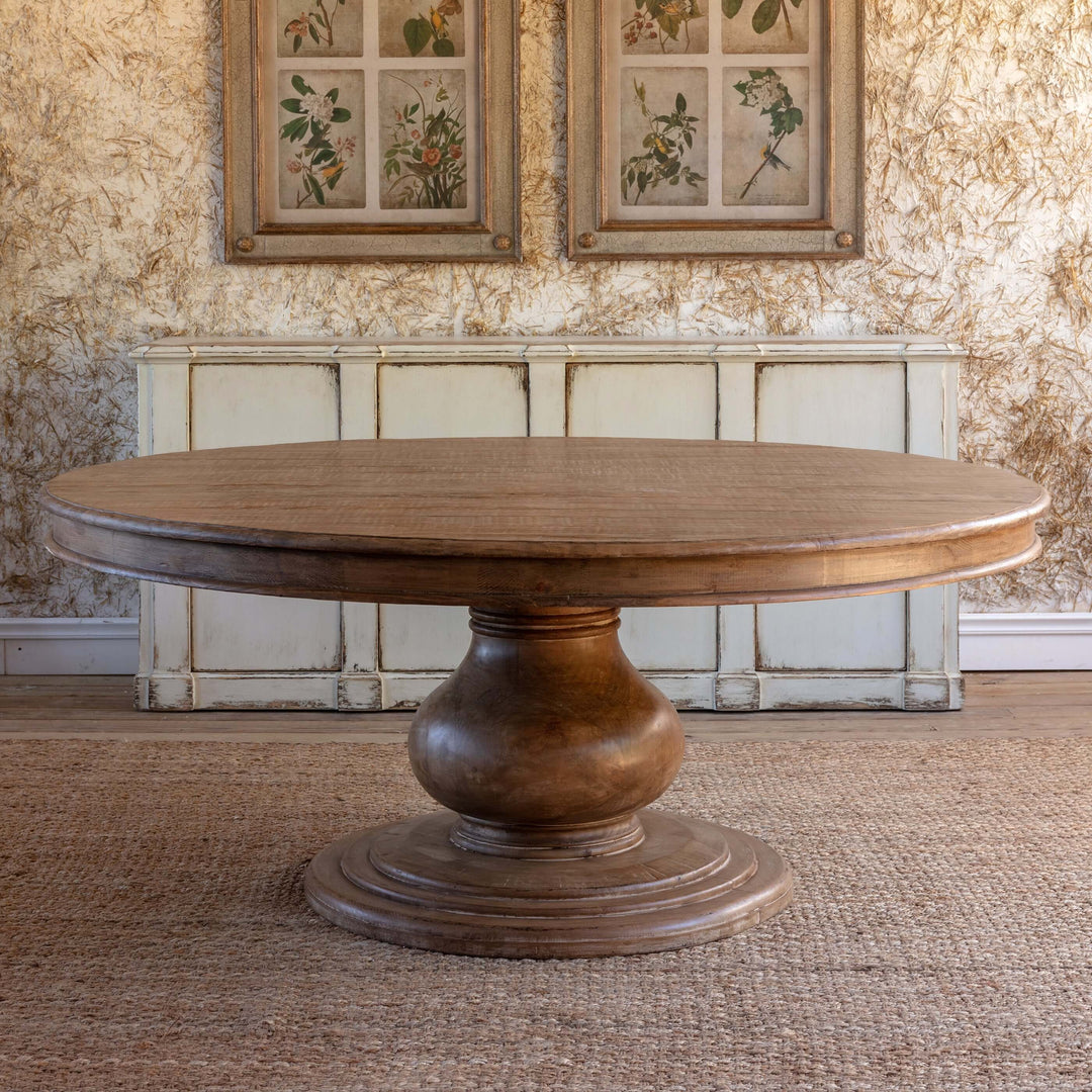 Vintage Farmhouse Round Dining Table with solid wood and pedestal base in stylish setting.