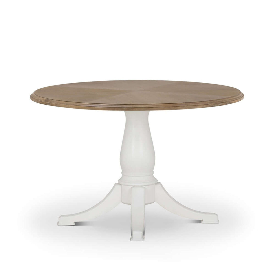 Vintage Farmhouse Round Pedestal Dining Table with rustic wood top and elegant white base, inspired by Cotswold heritage.