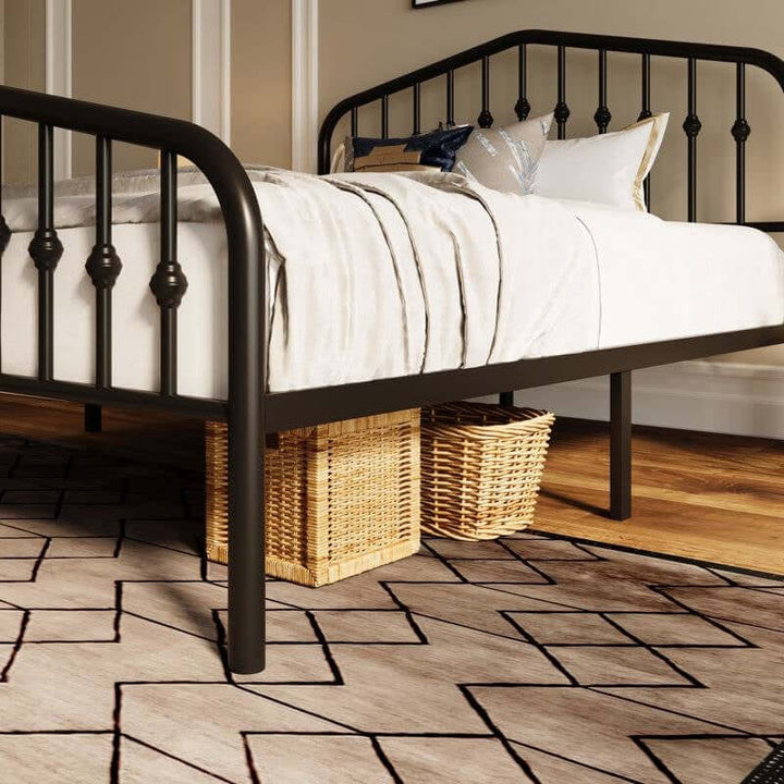 Vintage Farmhouse Spindle Black Metal Bed with arched headboard and classic spindle detailing in a cozy bedroom setting.