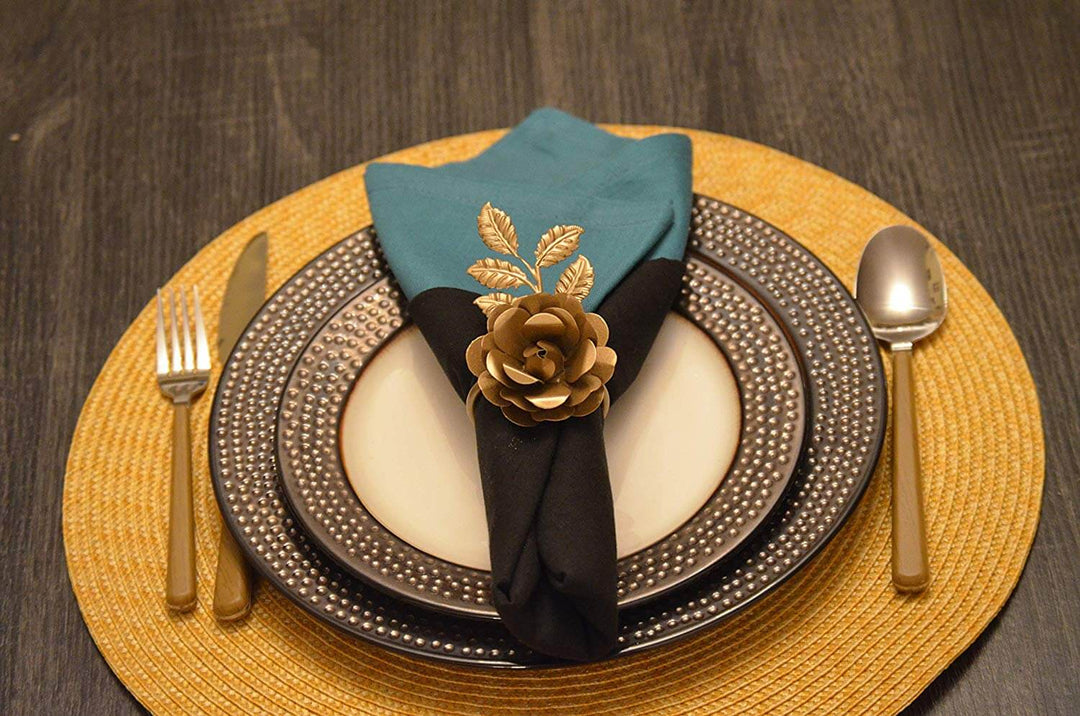 Vintage-Inspired Floral Golden Rose Napkin Rings (Set of 4) displayed on an elegant dining setup.