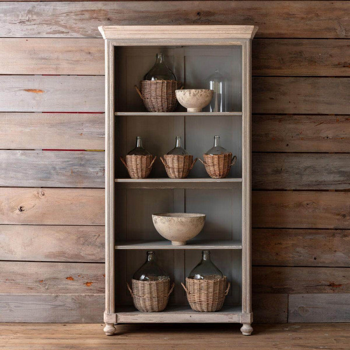 Vintage French Country Painted Wood Cabinet with a distressed finish, showcasing rustic charm against a wooden backdrop.