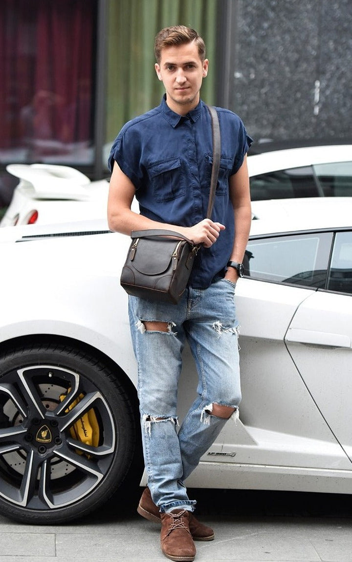 Man wearing Vintage Full-Grain Leather Camera Bag leaning on white car
