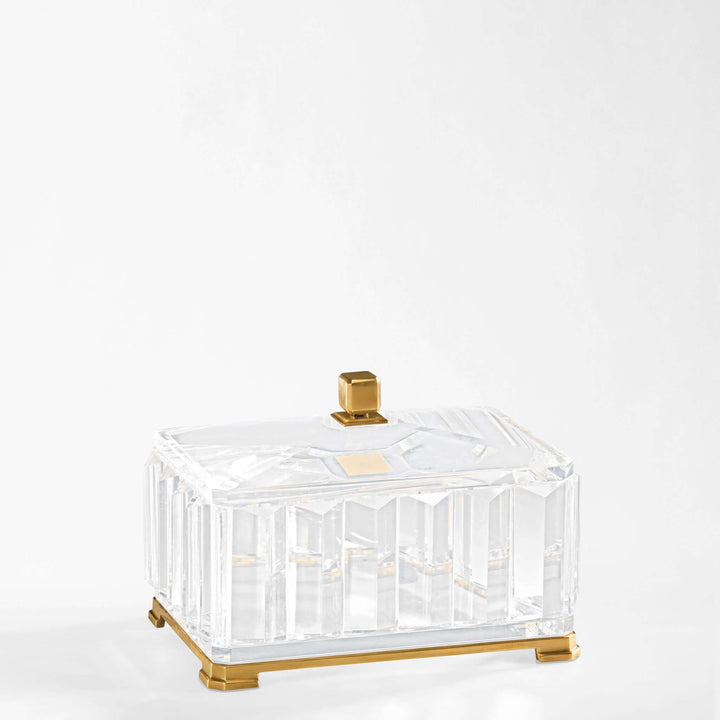 Clear crystal box with gold accents on a white background
