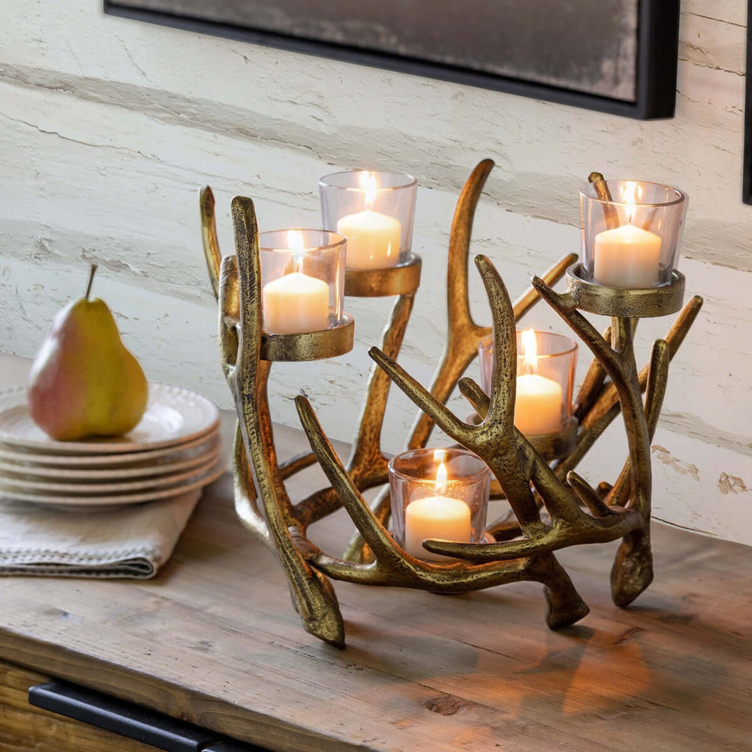 Vintage Gold Antler Candle Holder Centerpiece on table with glowing candles, rustic elegant decor piece.