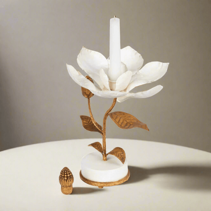 Vintage Gold Magnolia Candle Holder with white petals and golden center, hand sculpted from gilded metal on a smooth white base
