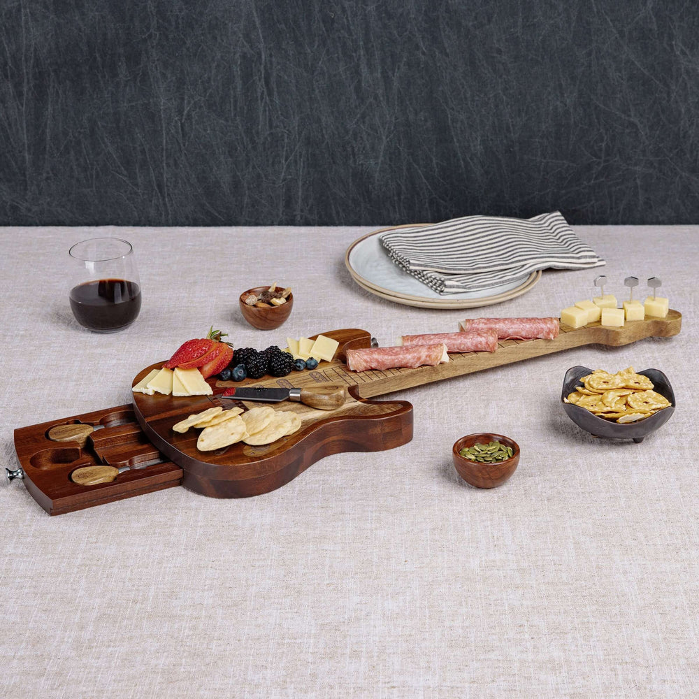 Vintage Guitar-Shaped Cheese Board with Hidden Drawer and Tools displayed with appetizers on a table.