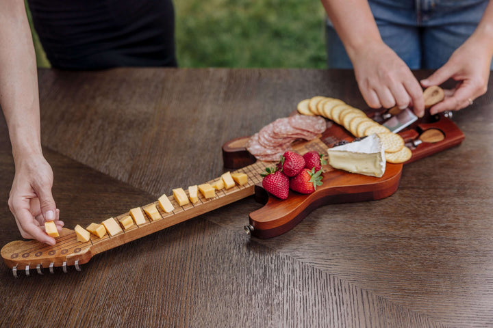 Vintage Guitar-Shaped Cheese Board with Hidden Drawer and Tools, showcased with assorted cheese, fruit, and serving tools.