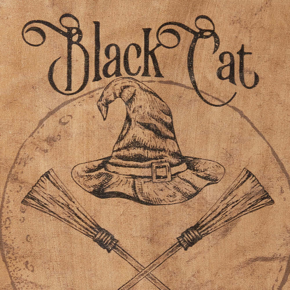 Vintage Halloween wall art featuring Black Cat text, witch hat, and crossed brooms on a parchment background.