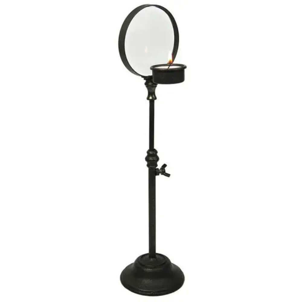 Vintage Iron Candle Holder with Magnifier featuring a dark finish and magnifying lens to enhance the flickering candlelight.