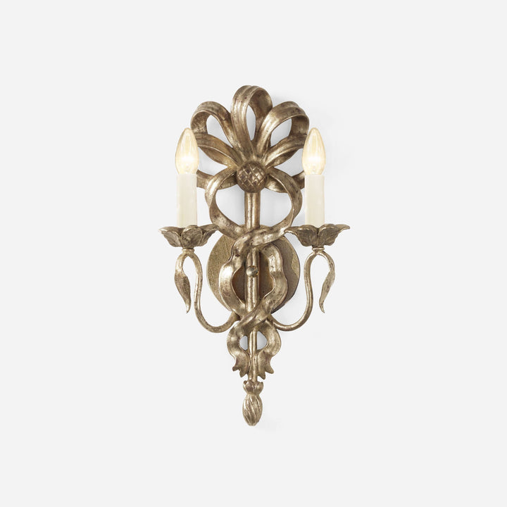 Decorative wall sconce with floral design on a white background