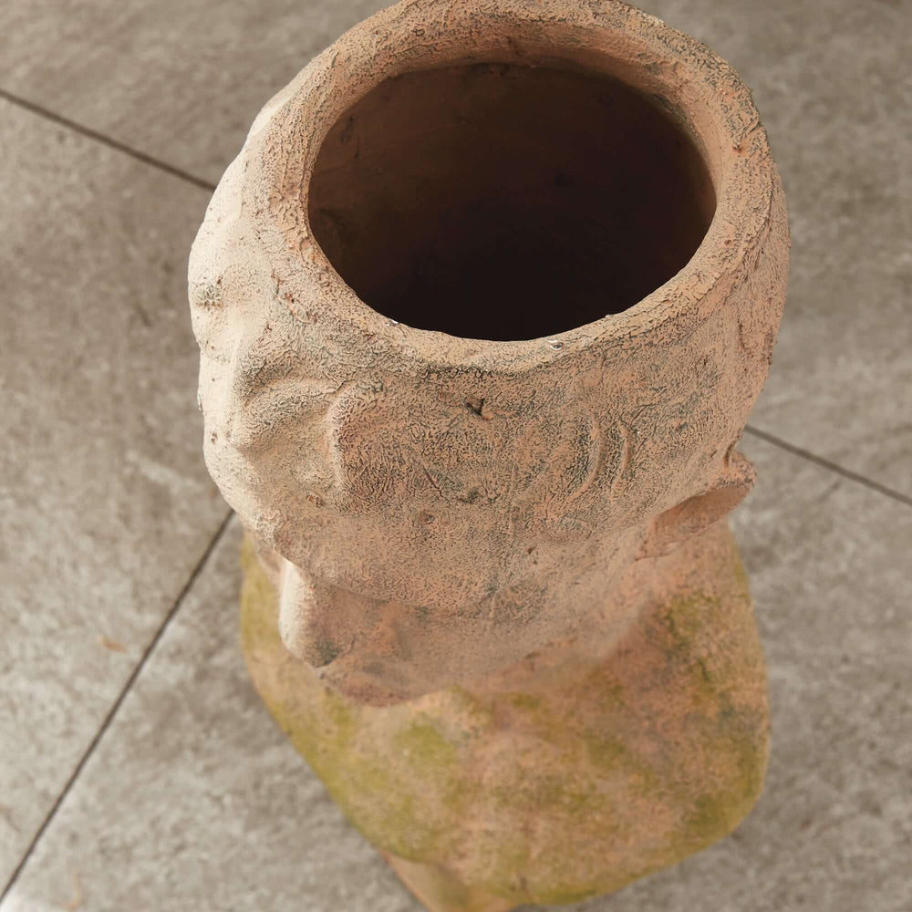 Vintage moss terracotta male bust planter with ancient Roman visage, showcasing sculpted artistry and classic elegance.