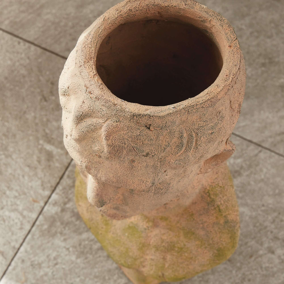 Vintage moss terracotta male bust planter with ancient Roman visage, showcasing sculpted artistry and classic elegance.