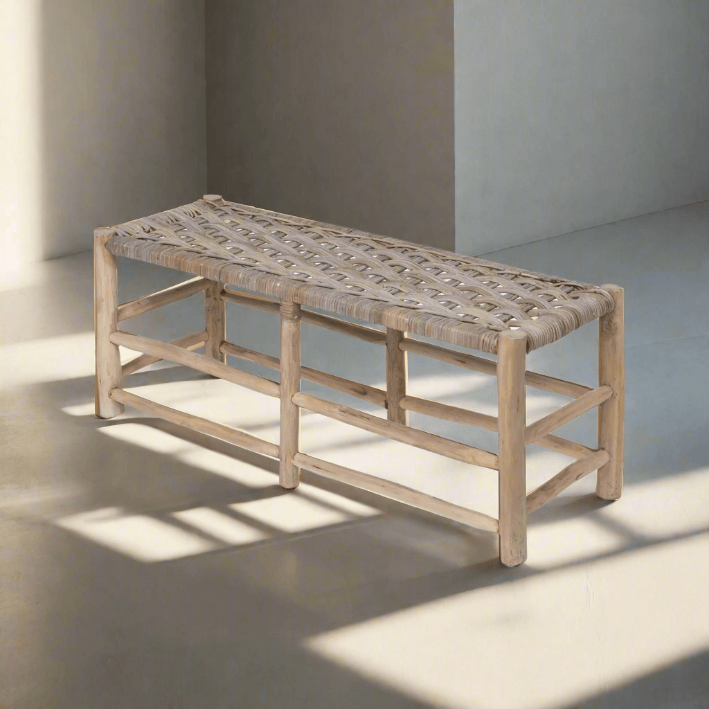 Vintage teak and rattan entryway bench with handwoven seat, showcasing classic design in natural sunlight.