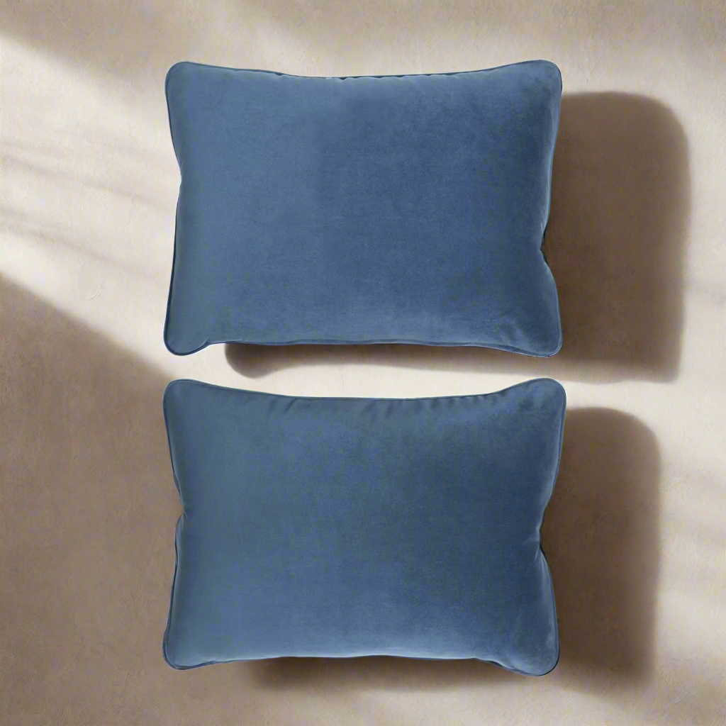 Vintage Velvet Throw Pillows in Atlantic Blue (Set of 2) display rich jewel tones and soft textures on a neutral background.