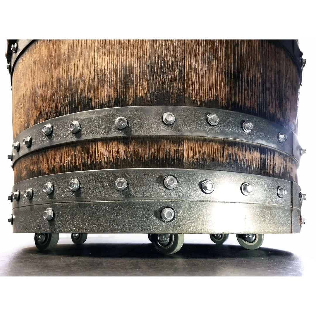 Close-up of Vintage Whiskey Barrel Chair on casters, featuring rustic wood and metal details.