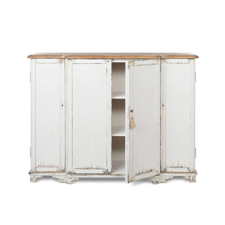 Vintage white entryway cabinet with distressed wood top, open door showing interior shelves, exudes rustic cottage charm.